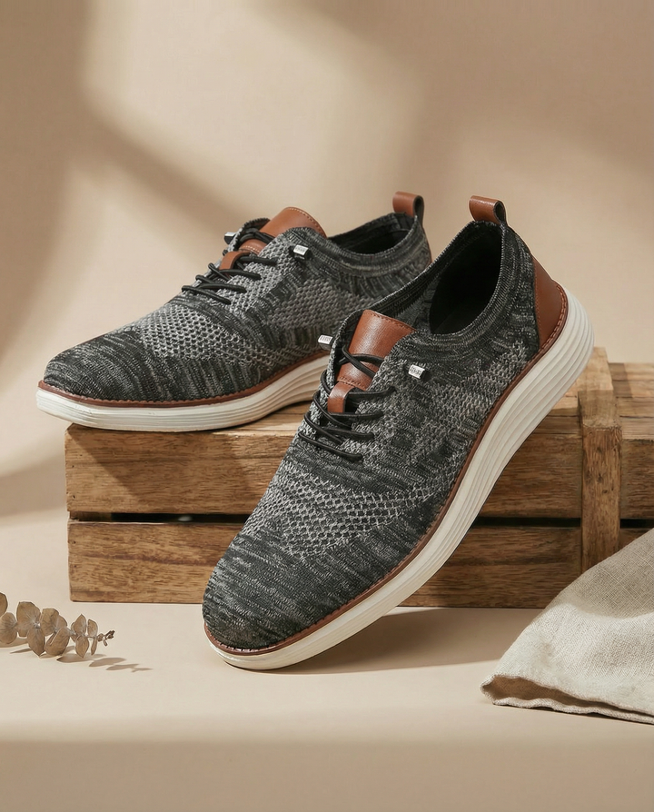 Close-up of men's knit sneakers, showcasing the detailed breathable fabric and comfortable design.