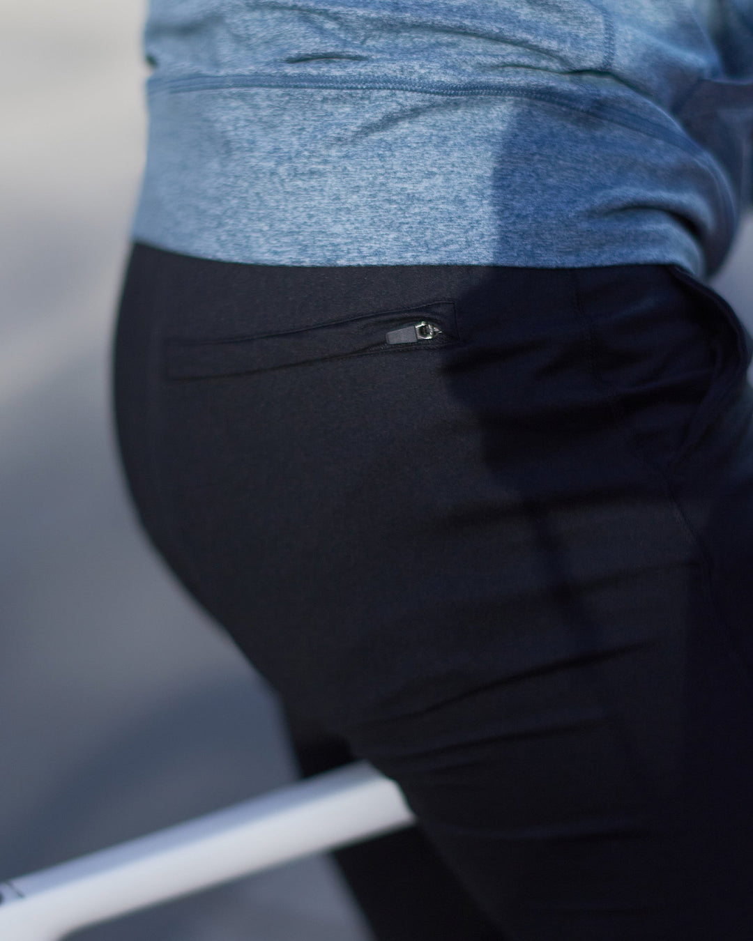 Man stretching before a workout in Men's Valencia Joggers, ideal for athletic bottoms