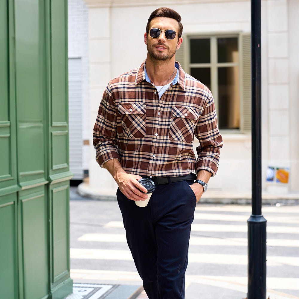 Man enjoying a campfire in a cozy Men's Verona Plaid Flannel Shirt, keeping warm in relaxed fit.