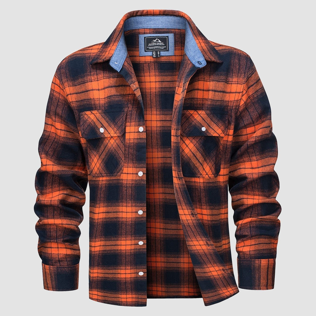 Folded Men's Verona Plaid Flannel Shirt on a wooden surface, green and navy plaid, soft cotton.