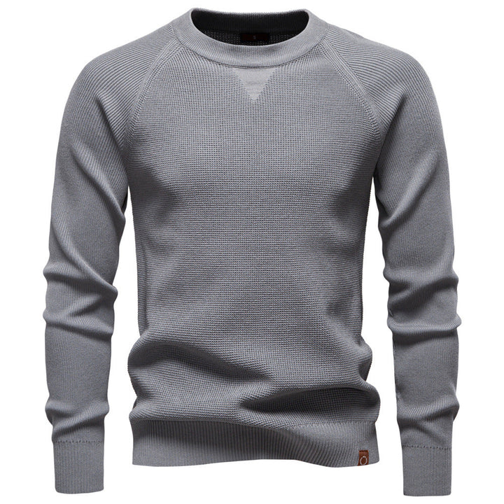 Hanger with a men's grey waffle knit long sleeve sweater, emphasizing its knitwear quality.