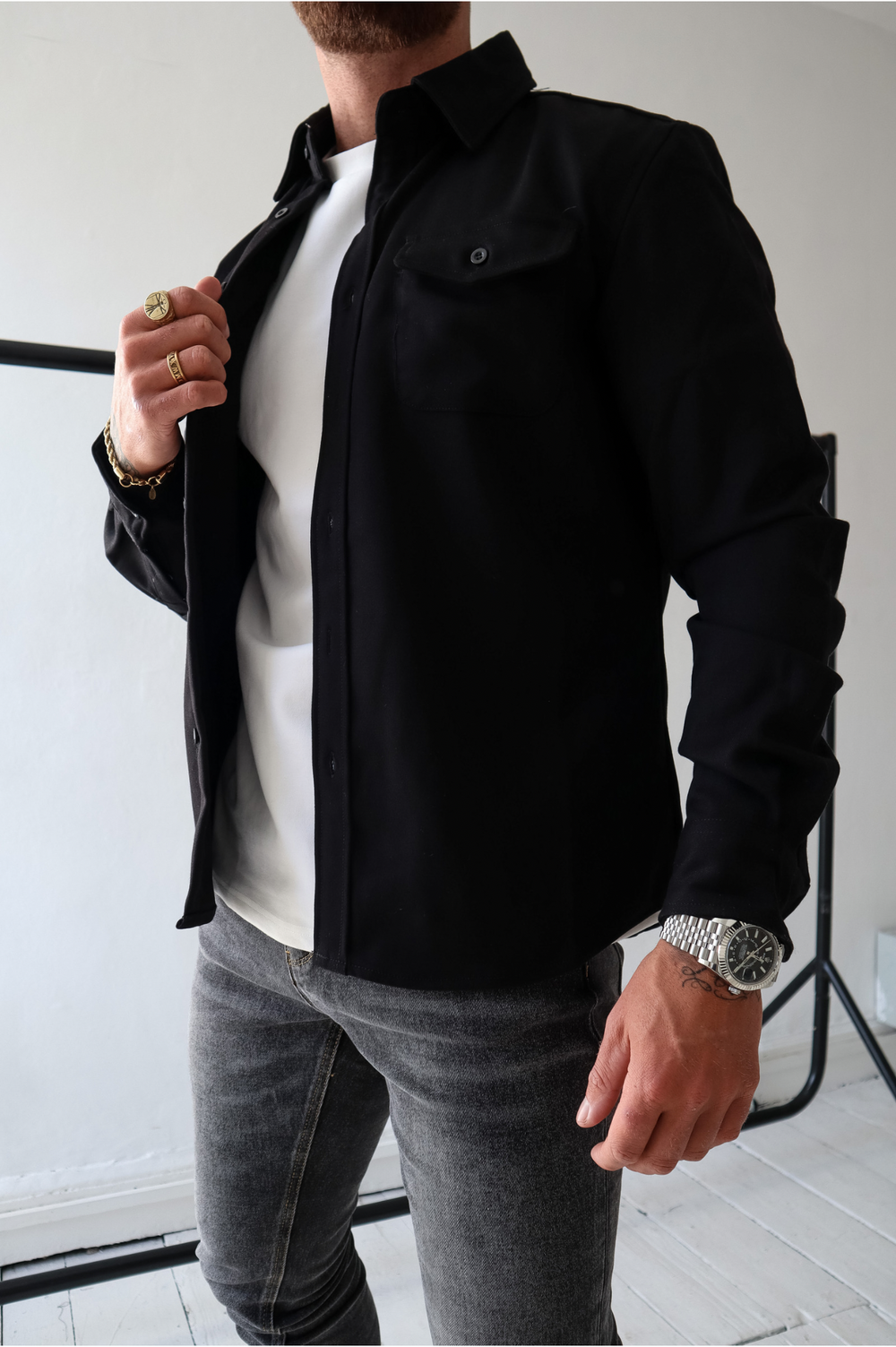 Stylish men's button-up overshirt jacket. Great for layering as casual everyday outerwear. Features long sleeves.