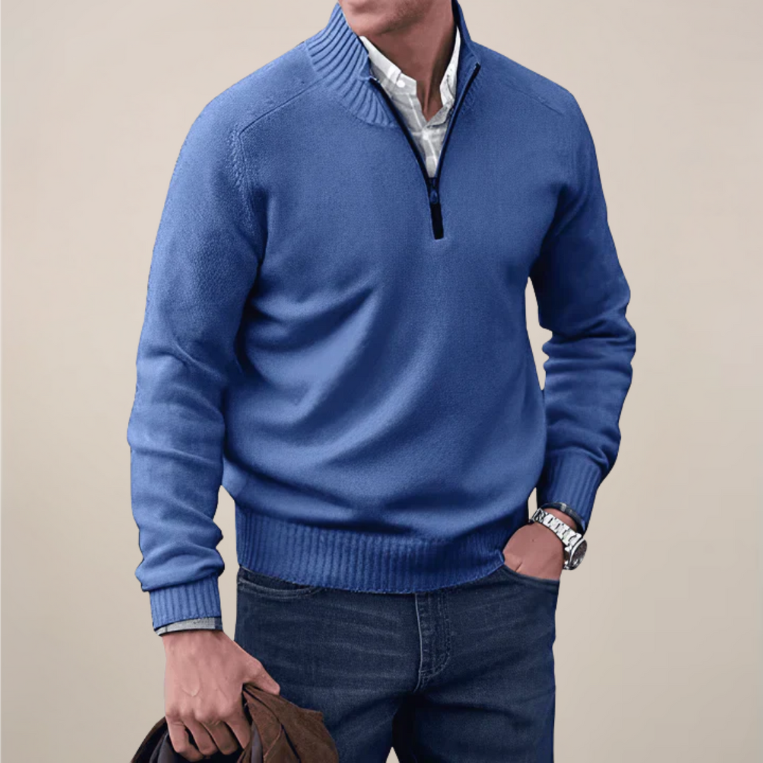 Man wearing a versatile half-zip knit sweater, perfect for layering in smart casual outfits.