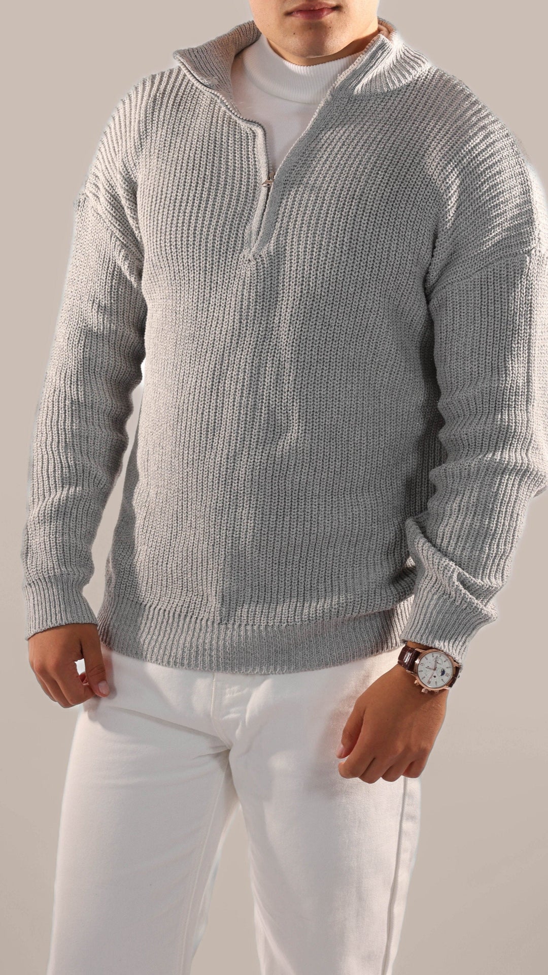 Comfortable men's knitted pullover with a half-zip, great for casual wear and essential winter layers.
