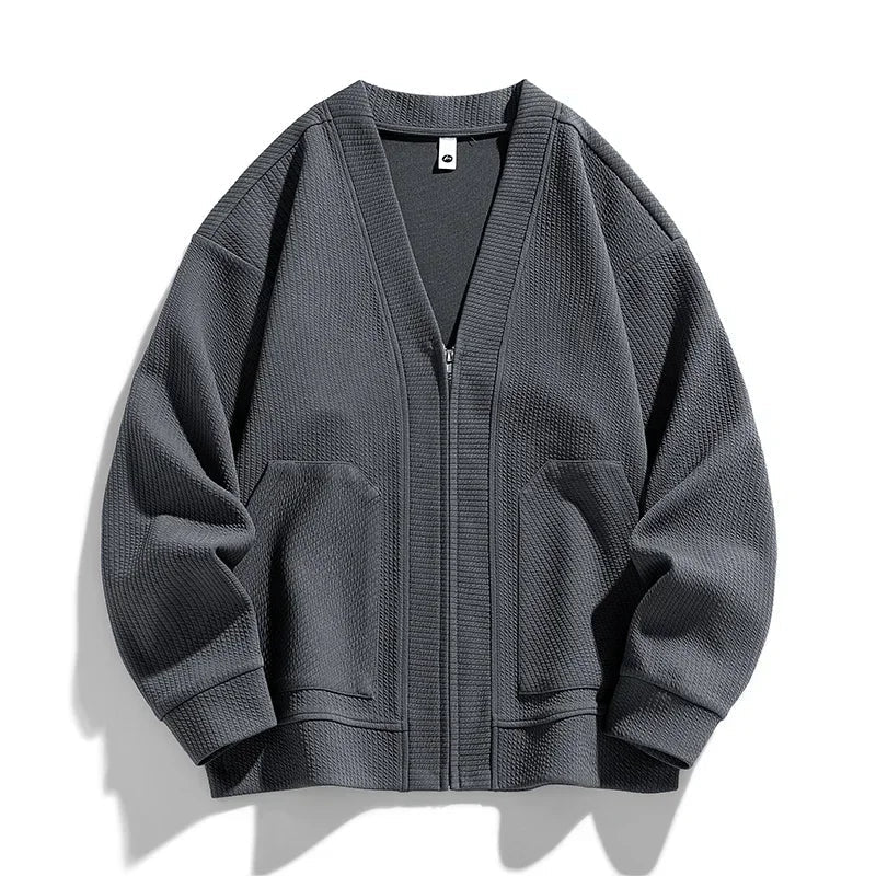 Green relaxed fit men's zip-up sweater, comfortable & versatile for layering or outerwear.