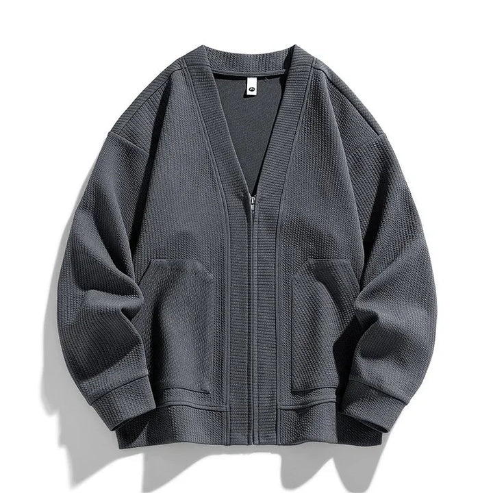 Green relaxed fit men's zip-up sweater, comfortable & versatile for layering or outerwear.