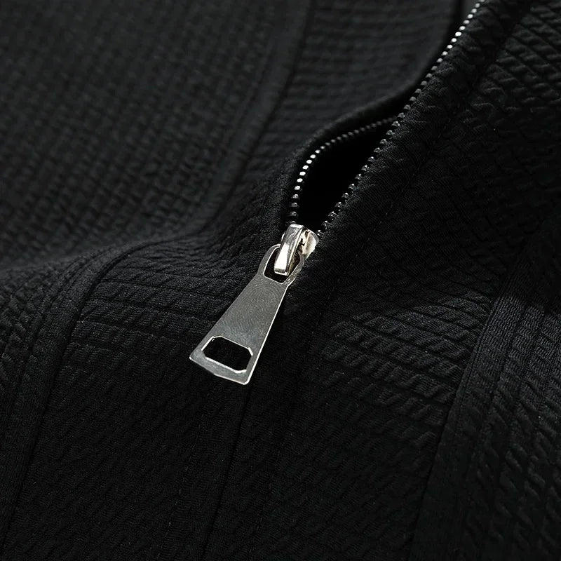 Black versatile relaxed fit zip-up sweater for men, great for layering & casual comfort.