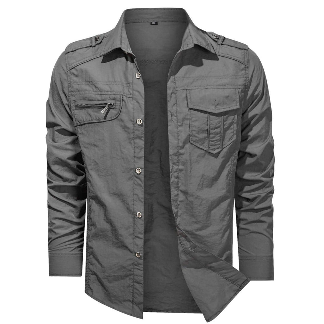 Detail shot of the pocket on a men's polyester soft shell shirt, showing its practical design for outdoor use.
