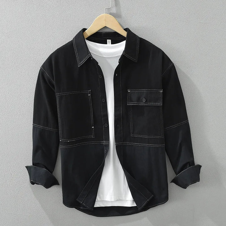 Relaxed fit men's button-up utility overshirt with modern color block design for workwear fashion.