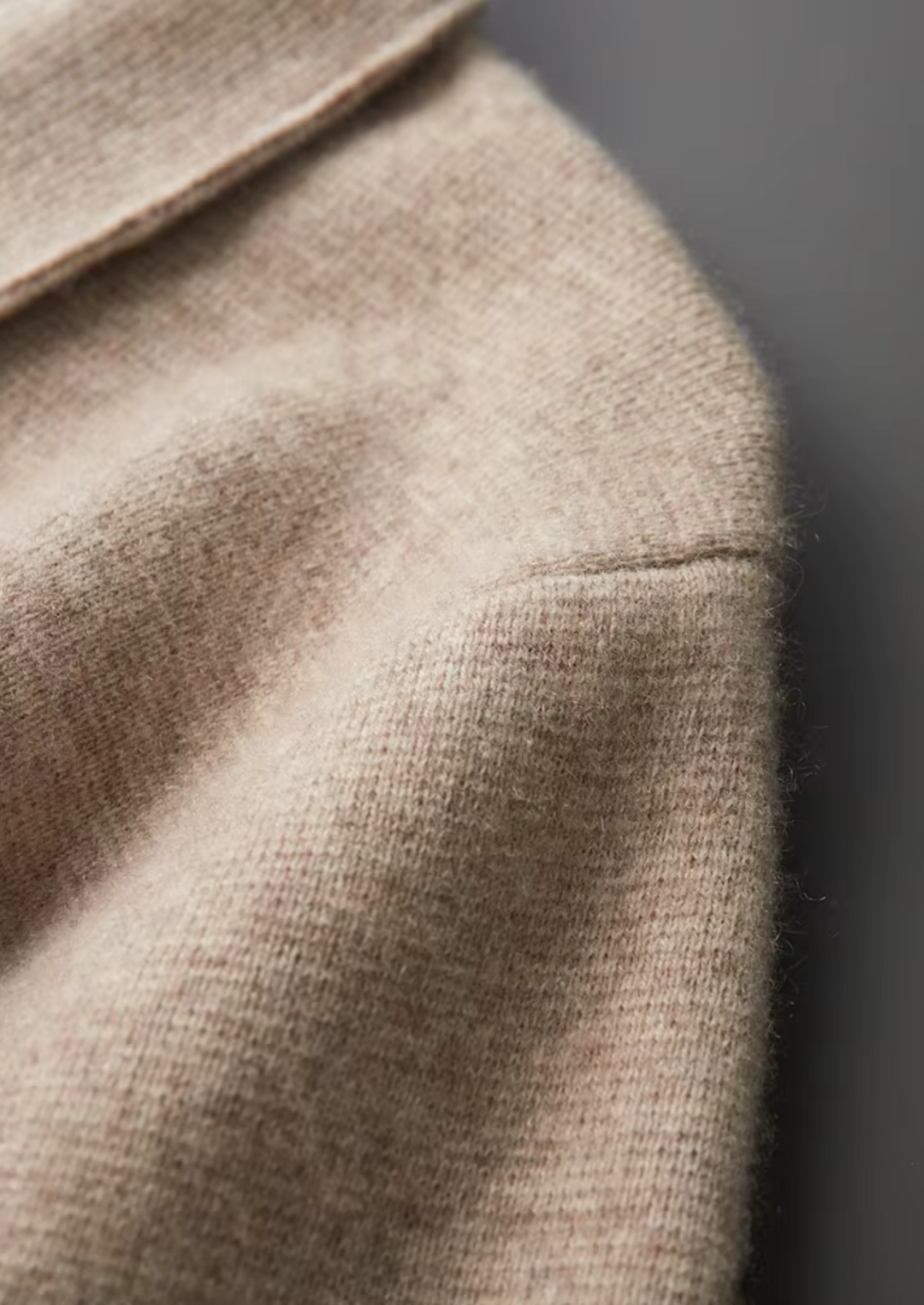 Stylish man in a modern zip-up cardigan sweater, a versatile men's layering piece for any occasion.