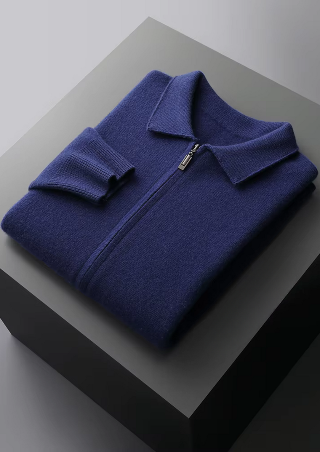 Men's versatile zip-up cardigan sweater on a hanger, showcasing its elegant drape and quality design.