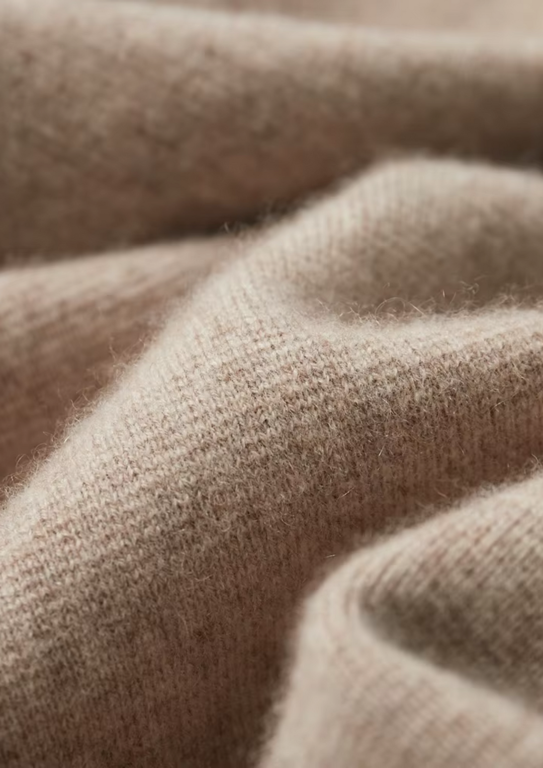 Detail shot of the sturdy zipper and collared neckline on a men's versatile cardigan sweater.