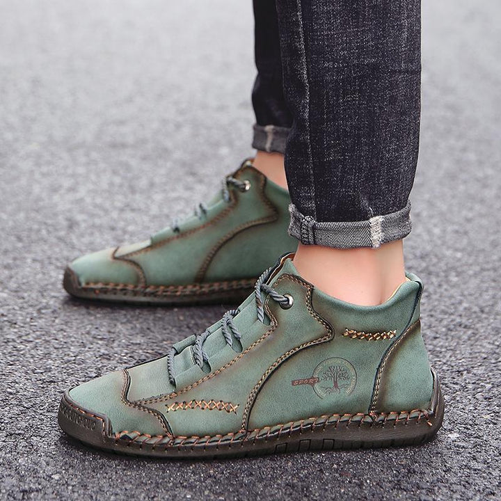 High-angle shot of men's vintage leather orthopedic boots, ready for fall fashion adventures.