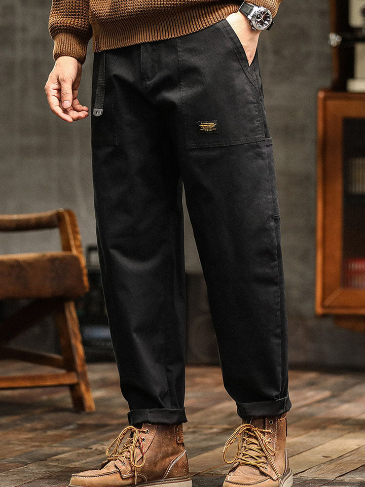 Black men's vintage-style utility pants. Comfortable, relaxed fit cargo trousers for fashion & outdoor.