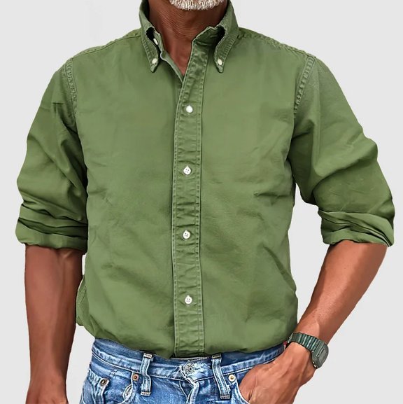 Detail of men's vintage button down shirt, relaxed fit long sleeve. High-quality fabric, classic style for men.