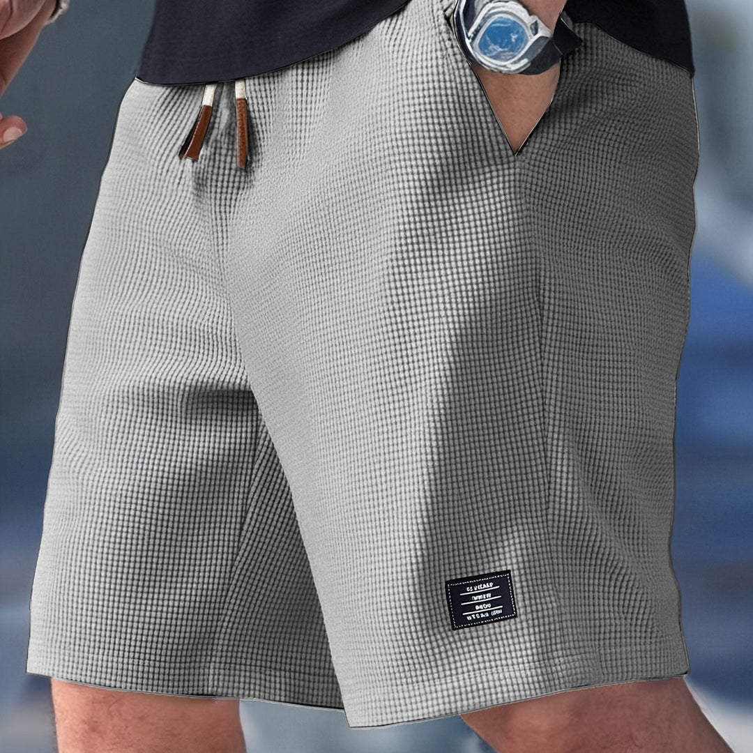 Textured waffle knit men's shorts, relaxed fit for ultimate comfort. Essential casual wear for summer days.