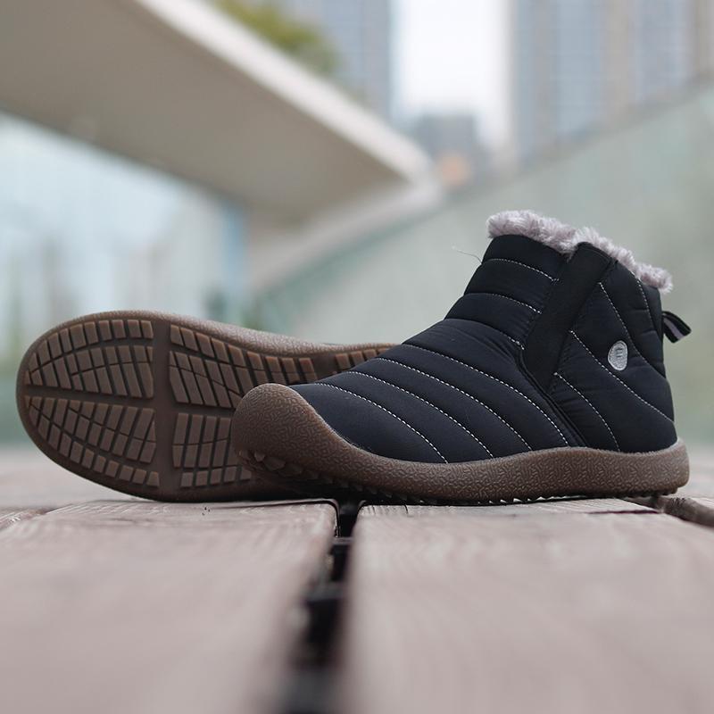 Detail of lacing system on men's black winter ankle boots, secure and comfortable