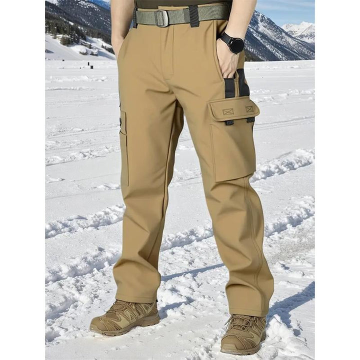 Close-up of men's utility cargo pants with soft fleece lining, showing pocket detail and fabric texture.