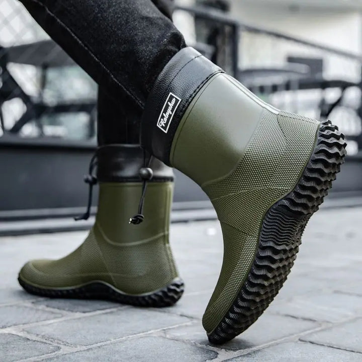 Pair of men's waterproof brown ankle work boots, ideal for tough outdoor conditions, comfort fit