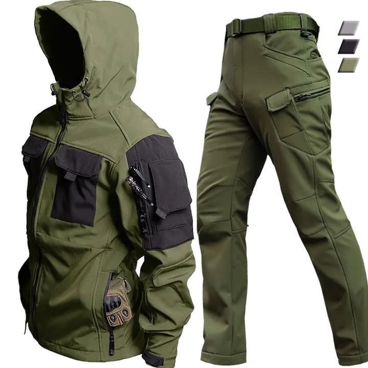 Gray men's waterproof hiking suit with jacket & trousers. Adventure apparel for outdoor sports and cold weather.