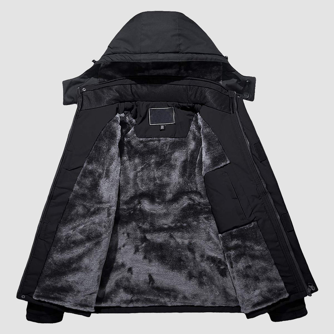 Underarm vents on men's red waterproof jacket, regulating body temperature.