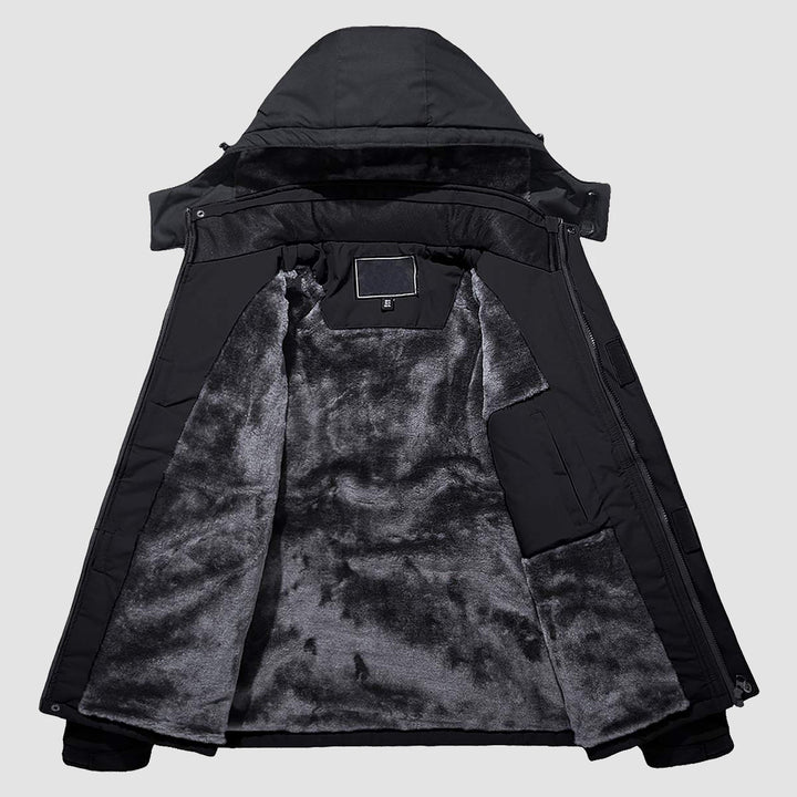 Underarm vents on men's red waterproof jacket, regulating body temperature.