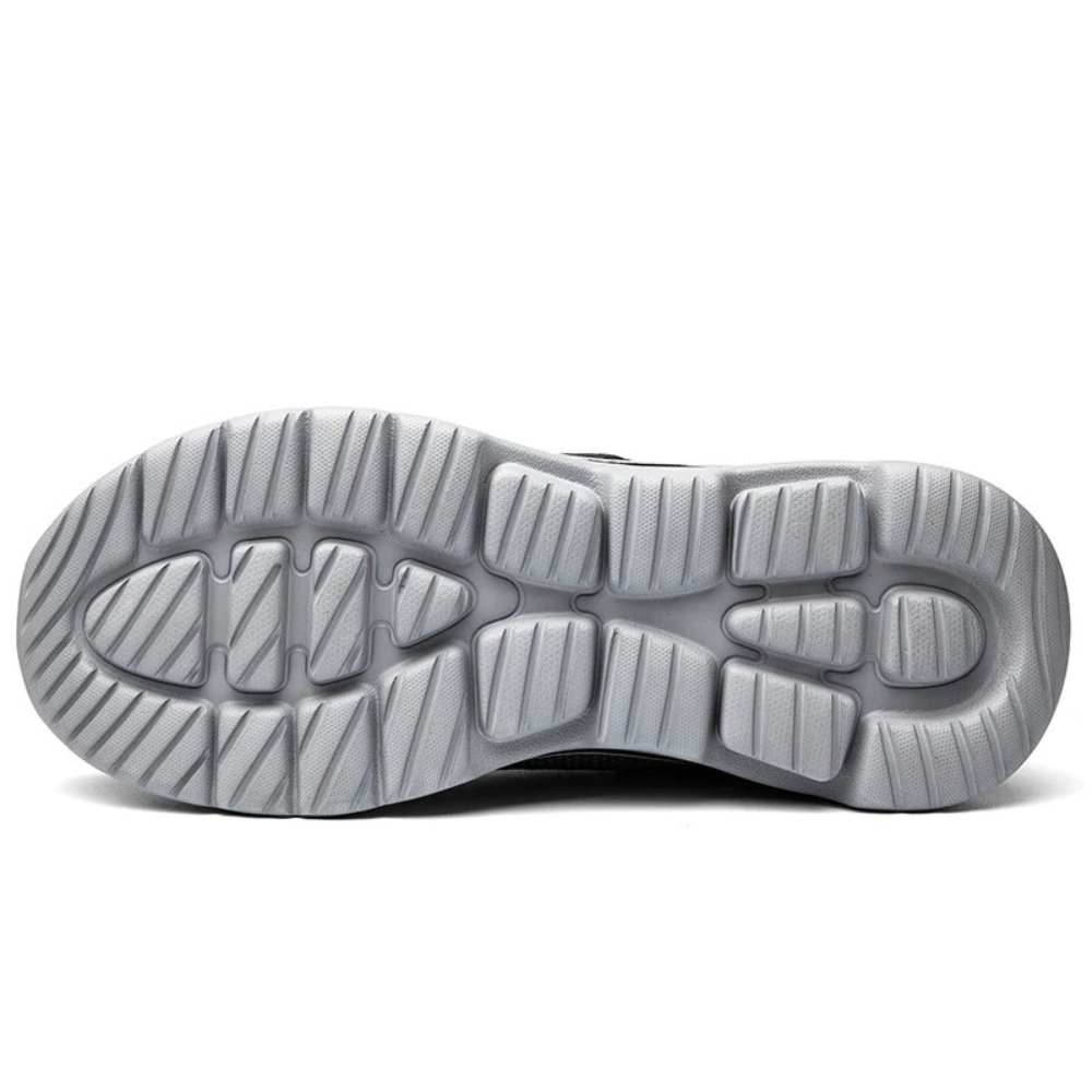 Pair of men's wide fit orthopedic slip-on shoes for foot health. Features adjustable Velcro for comfort.