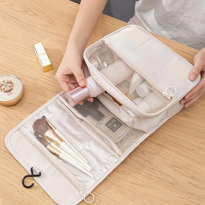 Hanging waterproof travel toiletry bag for men & women, 6 compartments for organized essentials.