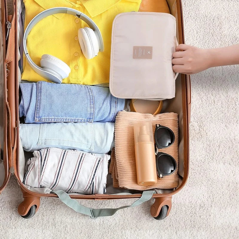 Compact polyester travel toiletry organizer bag with 6 compartments, ideal for gym & camping.