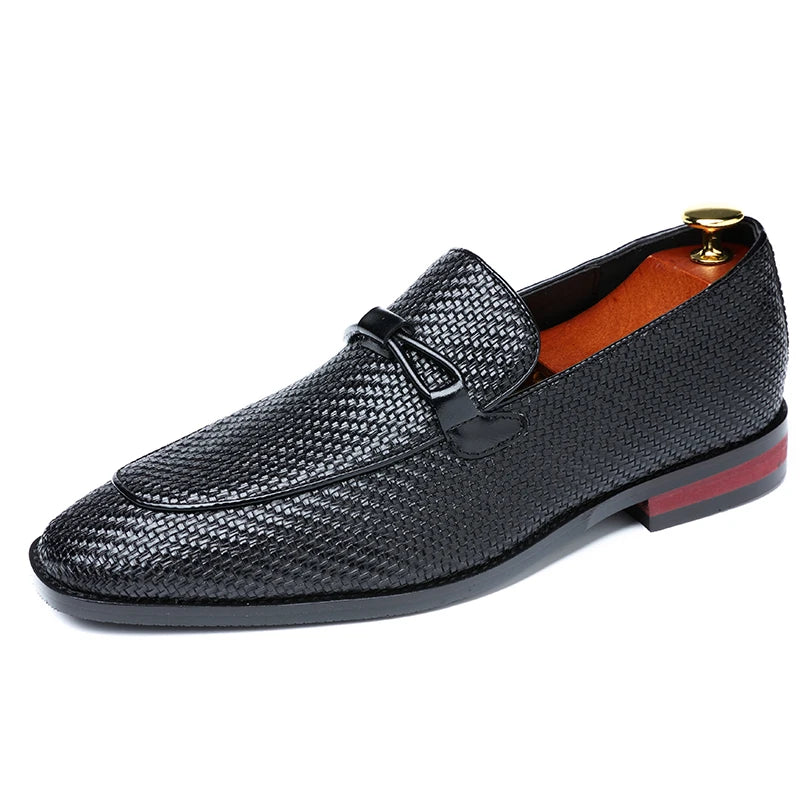Close-up of a men's woven oxford loafer, showcasing the intricate texture and classic style