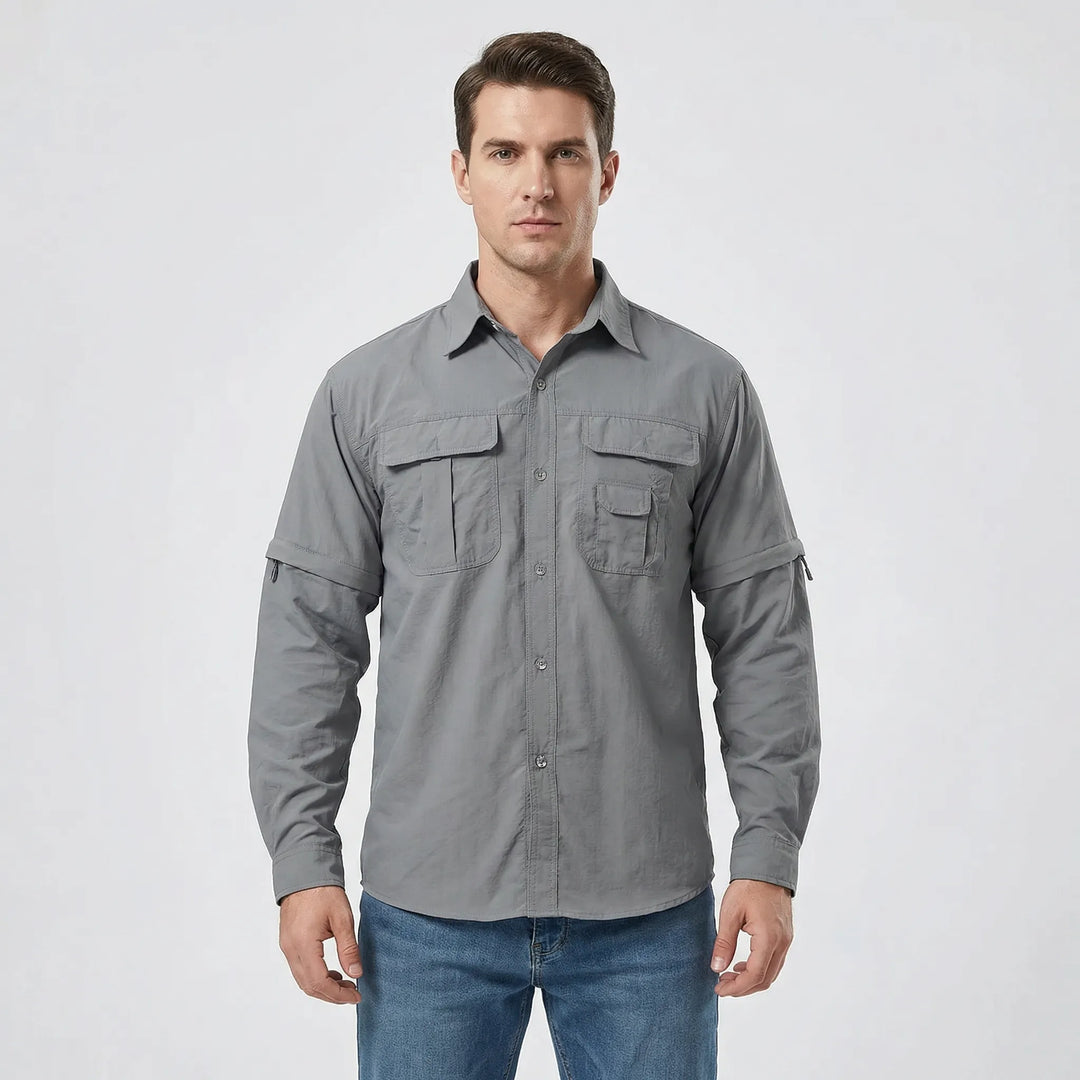Man wearing a versatile men's zip-off sleeve outdoor shirt for hiking, offering sun protection & comfort.