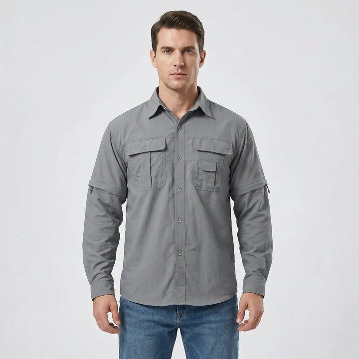 Man wearing a versatile men's zip-off sleeve outdoor shirt for hiking, offering sun protection & comfort.
