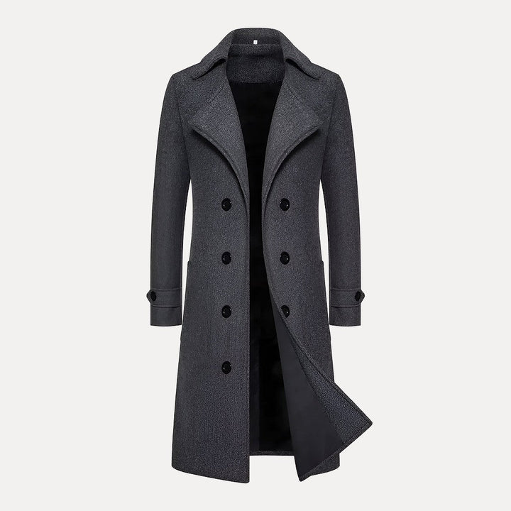 Formal men's double-breasted long coat with classic peak lapels. Elegant tailored overcoat, ideal for winter menswear.