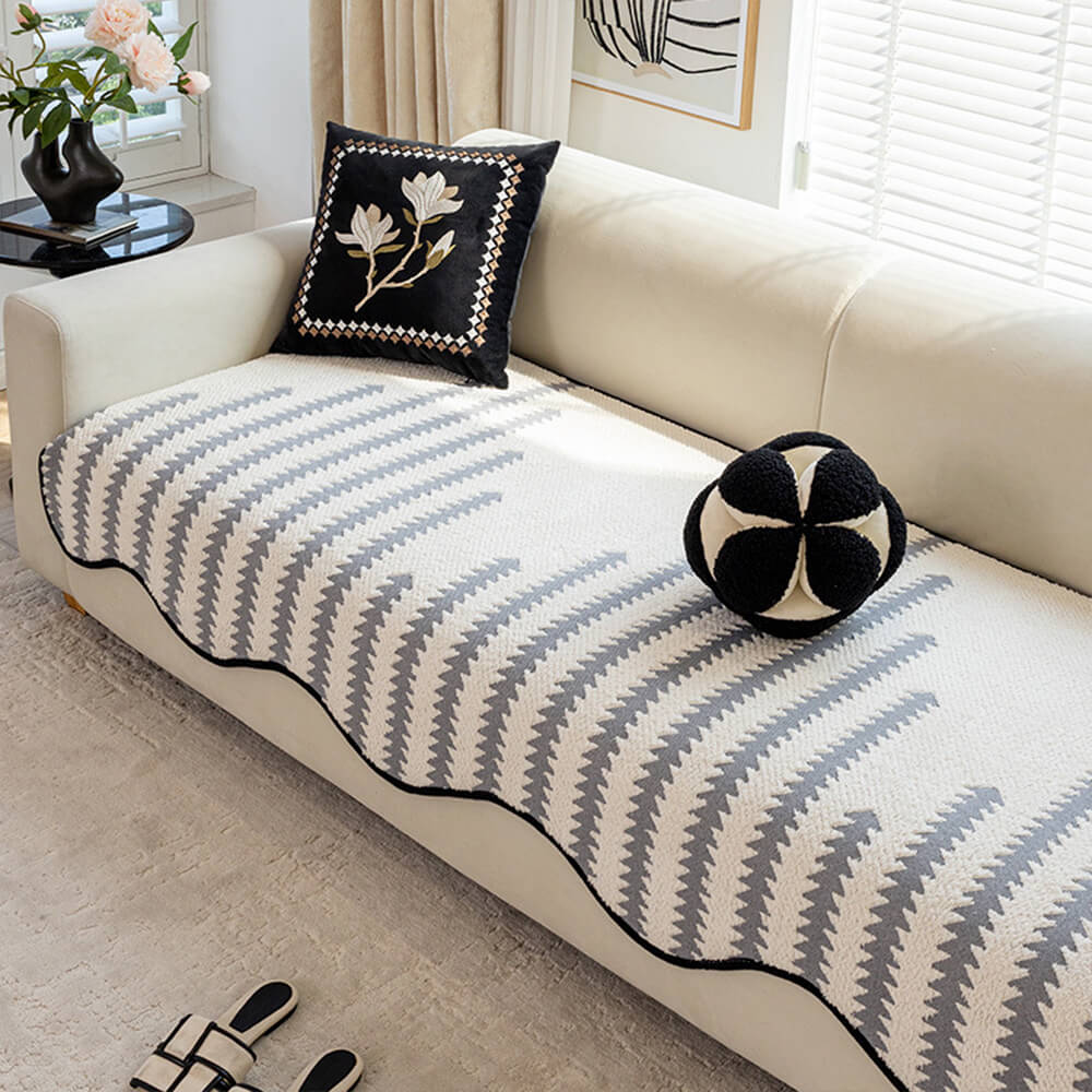 Durable chevron sofa cover with modern wavy edges. Non-slip couch protector for stylish living room decor.