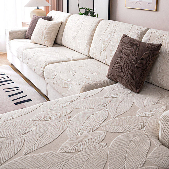 Elegant modern leaf jacquard sofa cover. Stretch fit, waterproof, anti-scratch, ideal for pets & home decor.