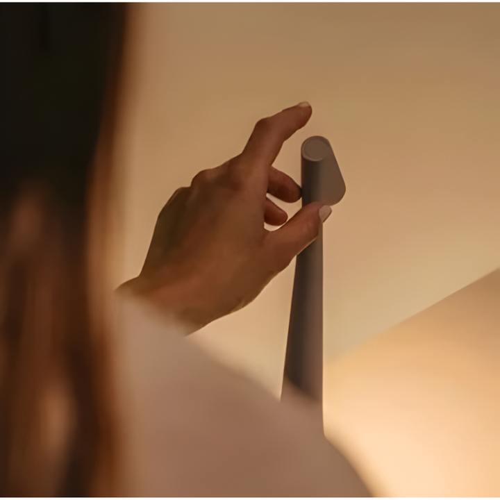 Rechargeable LED mood lamp with modern design, offering cordless, ambient lighting for versatility.