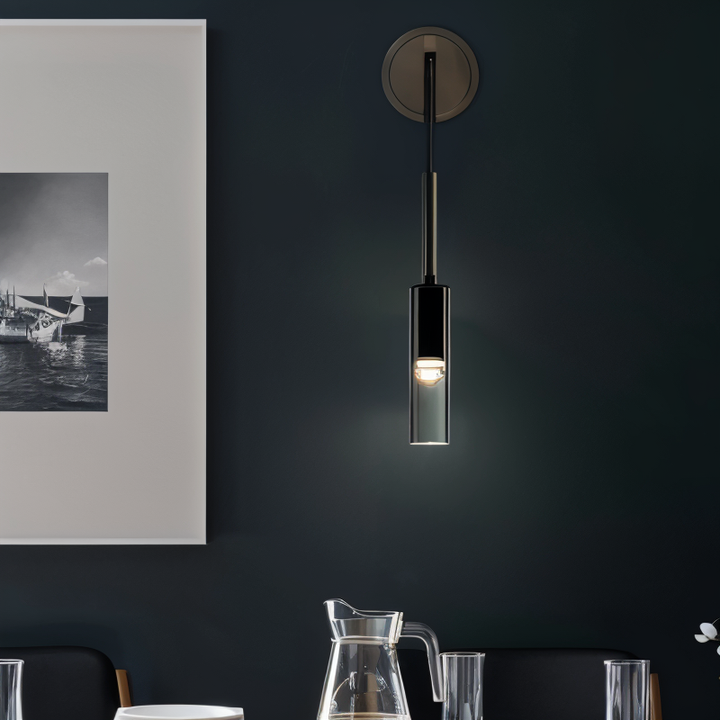 Modern accent wall lamp Orvane, with elegant smoke glass, enhances any contemporary home decor.