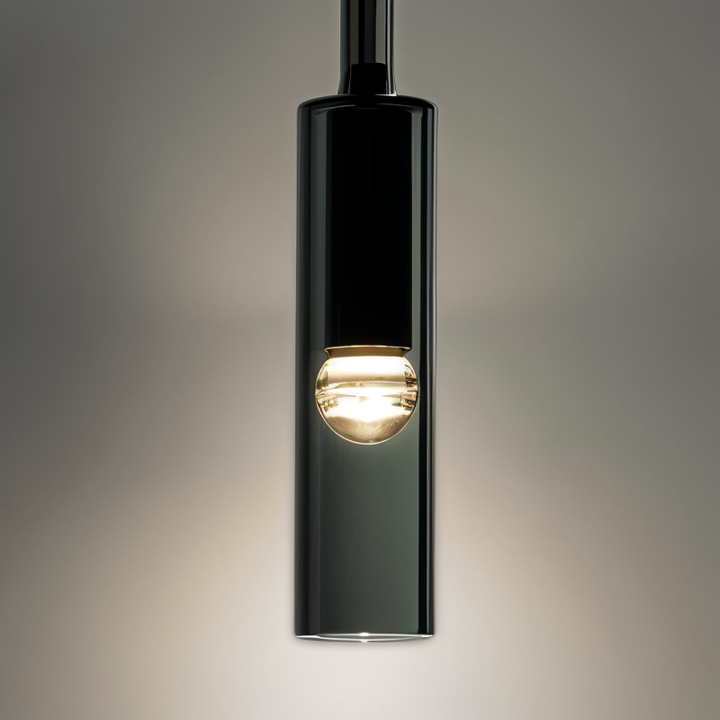 Sleek Orvane wall lamp, smoke glass shade, provides a warm glow for modern home lighting.
