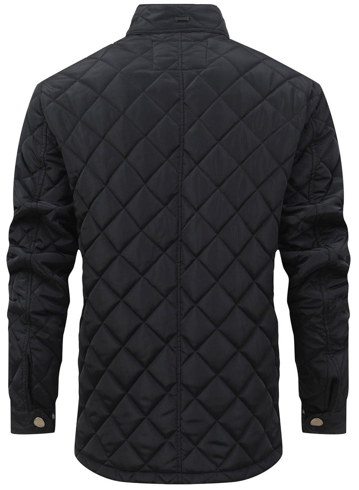 Casual women's quilted vest in a light gray, worn open, showcasing its layering potential.