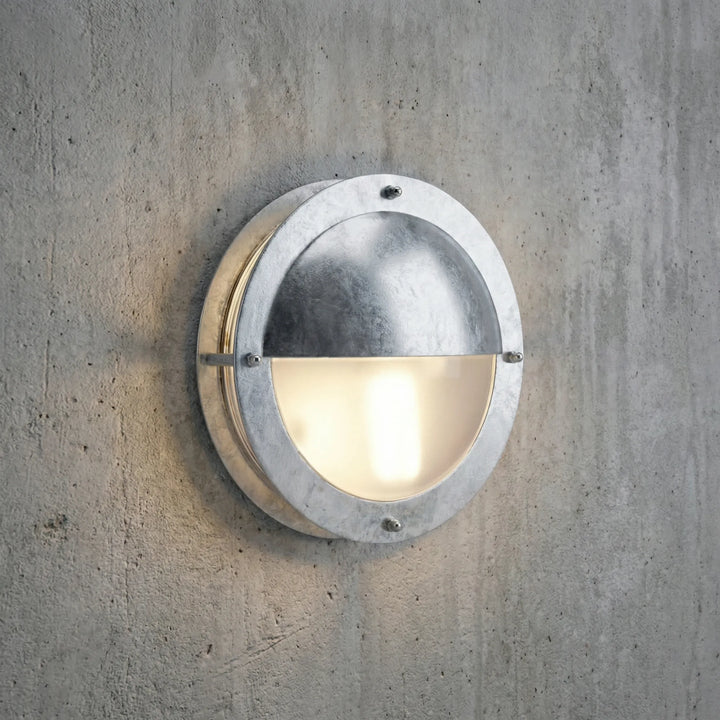 Dimmable round Marinova outdoor wall light, galvanized steel, perfect for patio & porch exterior.