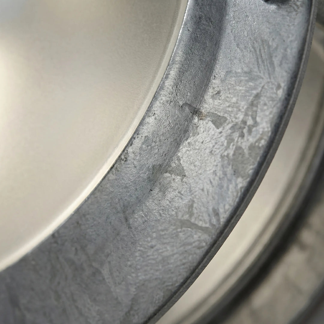 Weatherproof galvanized steel round outdoor wall light, modern design for entryways and patios.