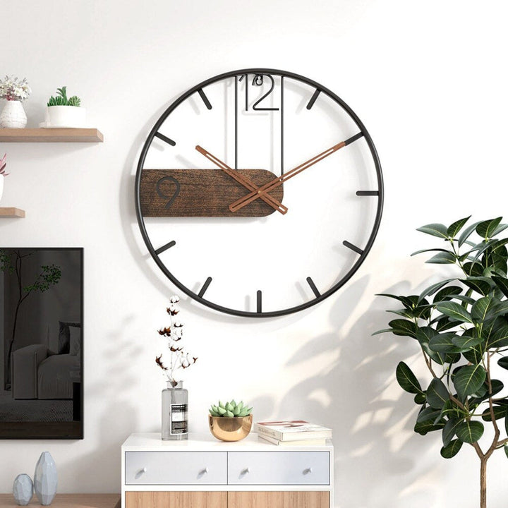 Stylish modern wall clock with silent quartz movement. Perfect decorative accent for contemporary home & office decor.
