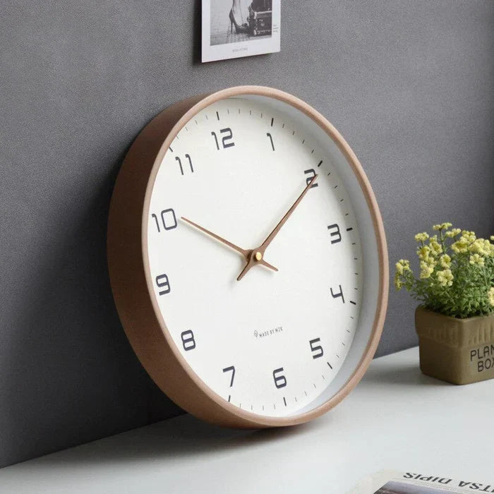 Elegant cream and brown wooden wall clock with silent mechanism. Ideal for modern home decor, enhancing living spaces.