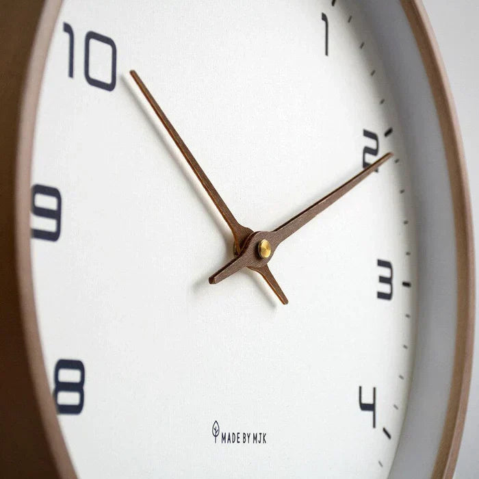 Decorative solid wood wall clock, a modern minimalist piece for office or living room. Natural aesthetic wooden decor.