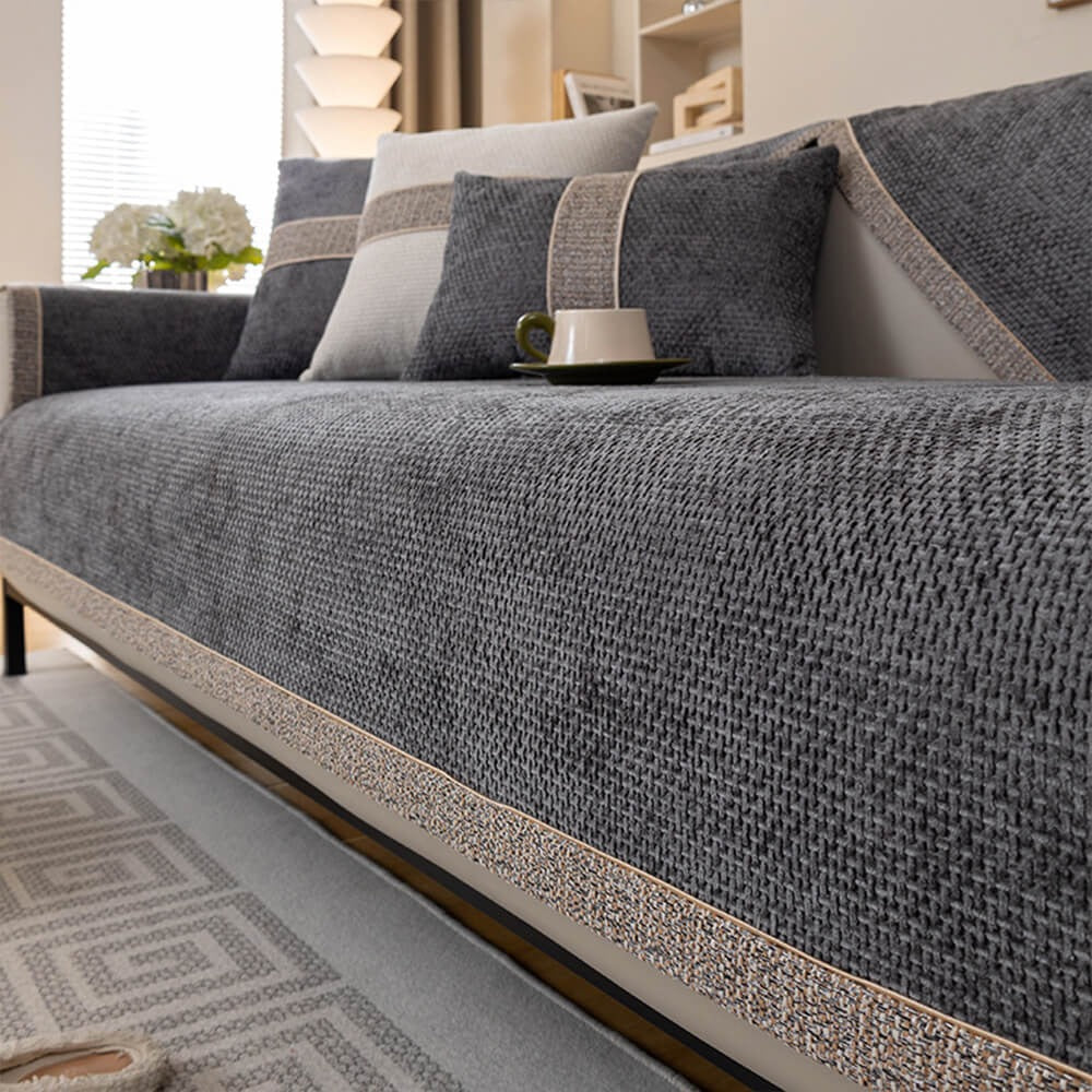 Full view of a sleek, modern tweed anti-slip sofa cover. Durable woven furniture protector for contemporary decor.