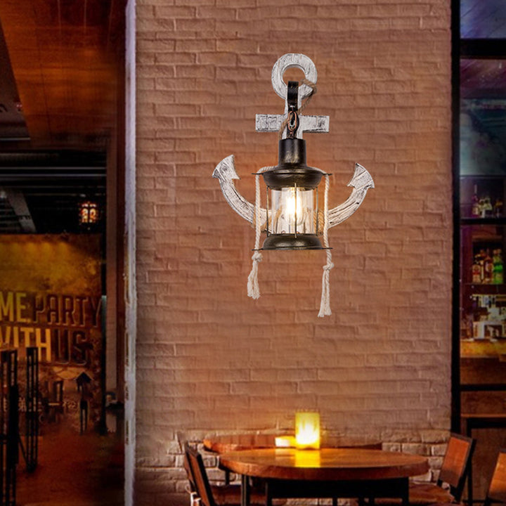 Elegant nautical anchor wall light. Coastal LED sconce for beach house and maritime themed home decor.