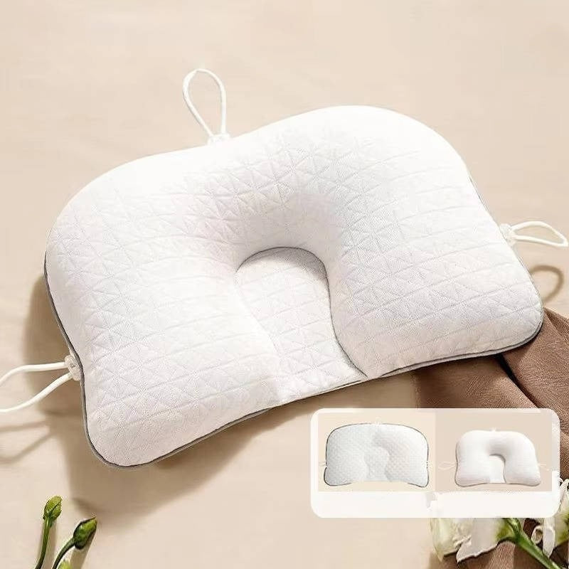 Pink baby pillow for flat head prevention, ensuring comfortable and safe infant sleep.