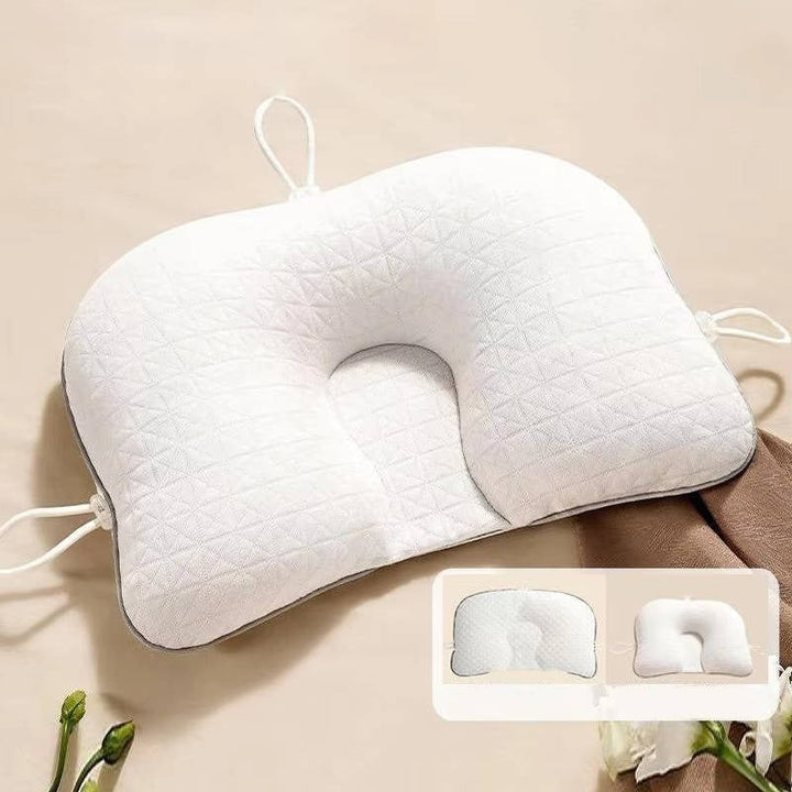 Pink baby pillow for flat head prevention, ensuring comfortable and safe infant sleep.