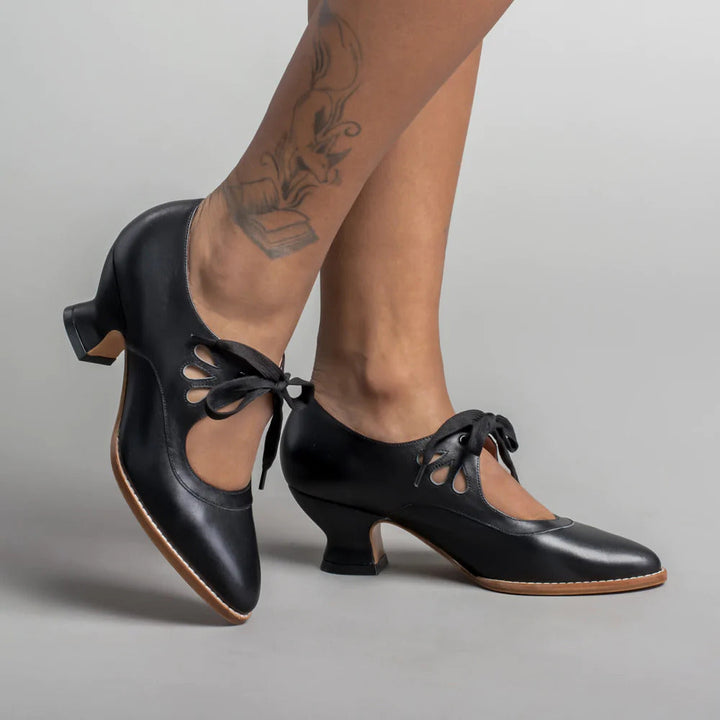 Women's elegant black orthopedic pumps, ensuring all-day comfort with arch and heel support.