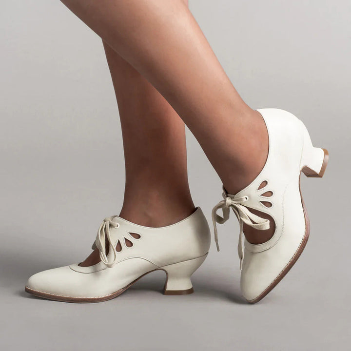 Elegant black leather orthopedic pumps for women, offering arch & posture support for comfortable all-day wear.